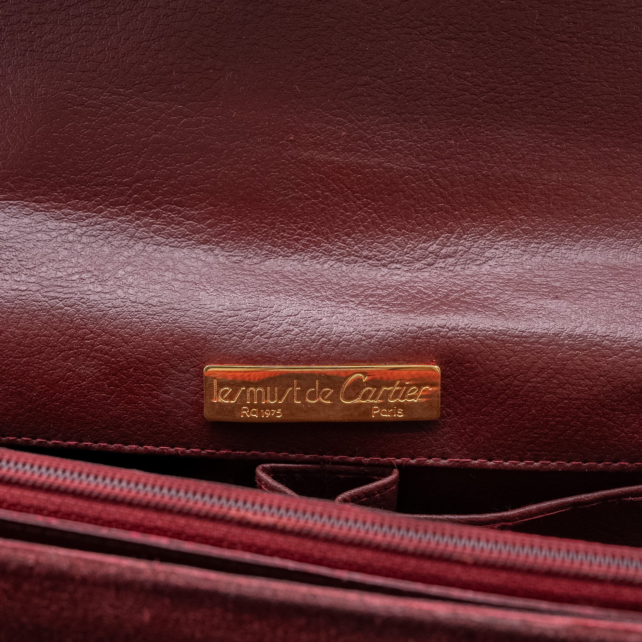 Cartier Les Must de Cartier Bordeaux Suede Clutch from the 1970's
